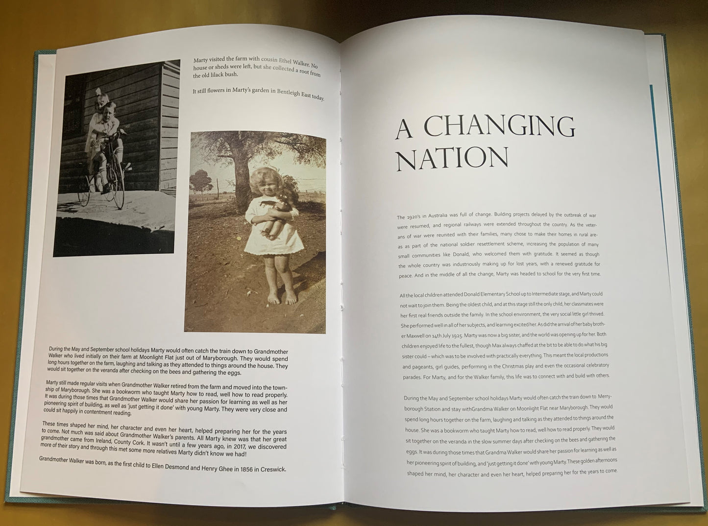 Example of a Telegram Society memoir. Open pages of book with childhood images, and a paragraph of text titled A Changing Nation. 